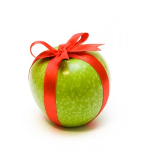 Fresh green apple packaging in red tape